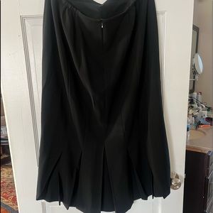 Ankle length black A-line skirt with 5 cute pleats on the back.